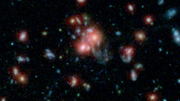 NASA Telescopes Find Galaxy Cluster with Vibrant Heart