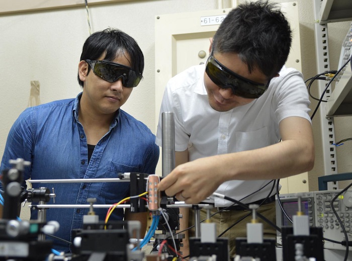 This photo shows researchers working with the MO Q-switched laser