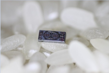 The new optical gyroscope—shown here with grains of rice—is 500 times smaller than the current state-of-the-art device