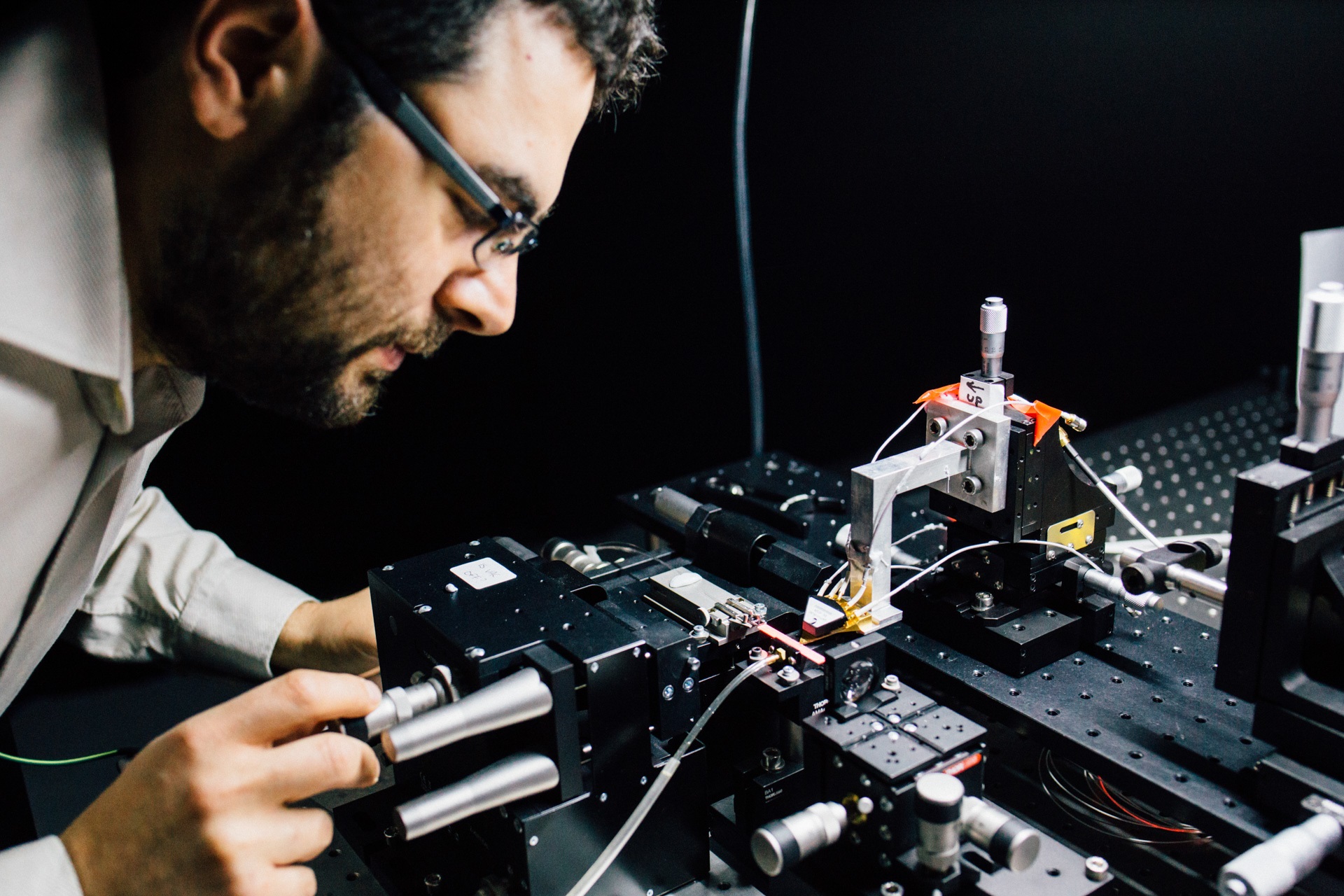 Assoc Prof Mirko Lobino works on the microchip.