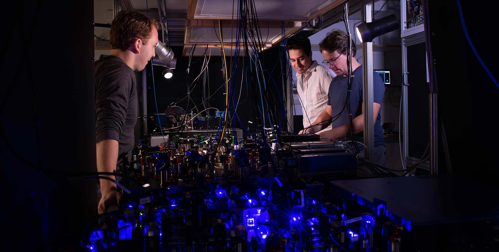 Adam Shaw, Ivaylo Madjarov and Manuel Endres work on their laser-based apparatus at Caltech