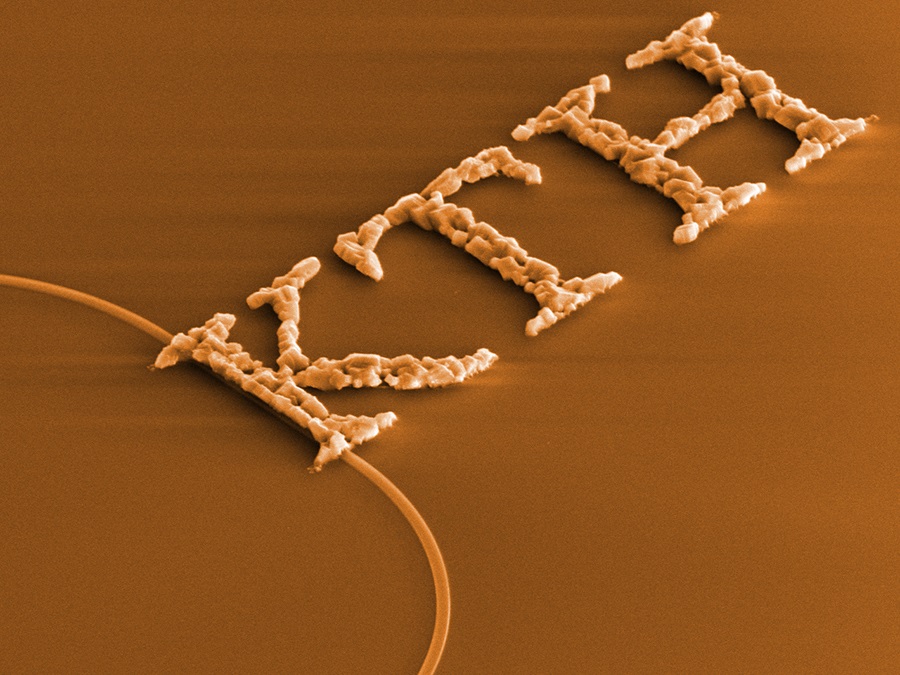 Synthesized copper oxide crystals arranged to spell out the name of the university where the production method originated - KTH Royal Institute of Technology.