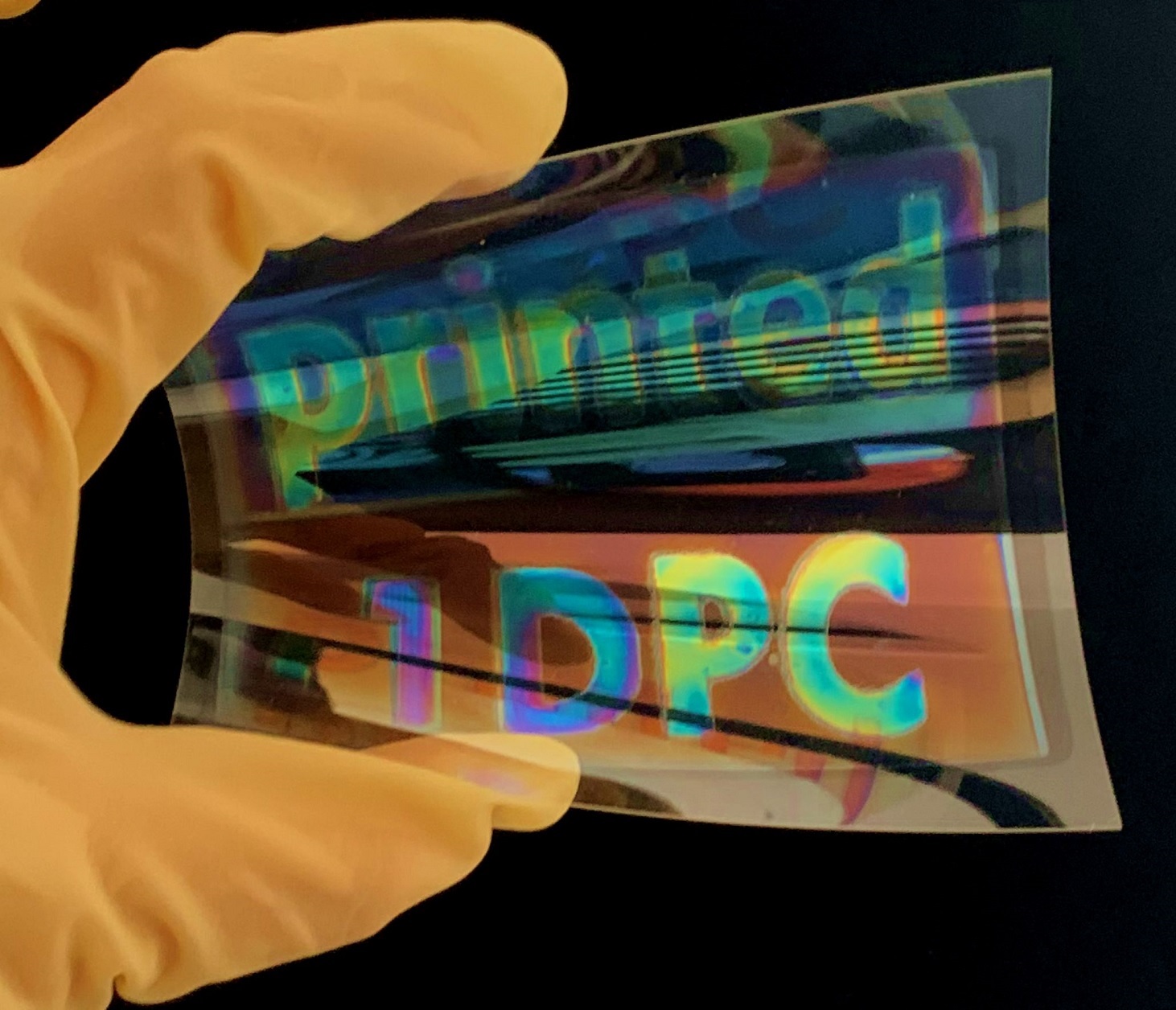 Colored mirror layer printed onto a foil. Inkjet printing allows for structurization, such that large-area logos can be printed as well