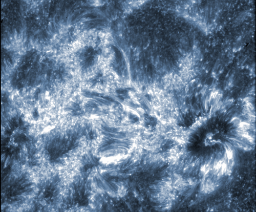 This image from NASA's IRIS spacecraft shows the region around two sunspots