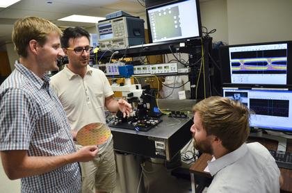 From left, Jeff Shainline, a postdoctoral researcher; Milos Popovic, an assistant professor of electrical, computer and energy engineering; and Mark Wade, a graduate student