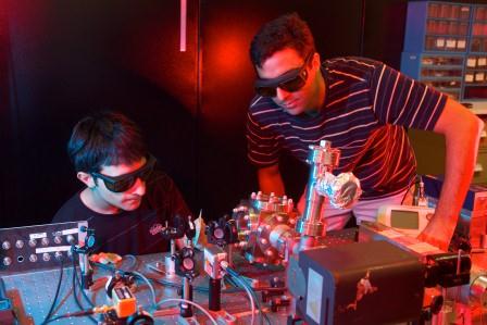 Dr Mahdi Hosseini and Mr Giovanni Guccione working on their opto-mechanical laser system