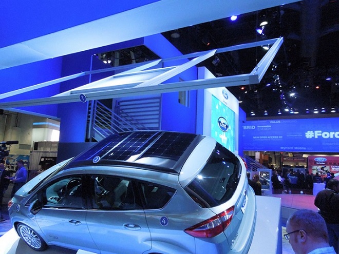 A model of the solar concentrator hangs above the C-MAX Solar Energi Concept