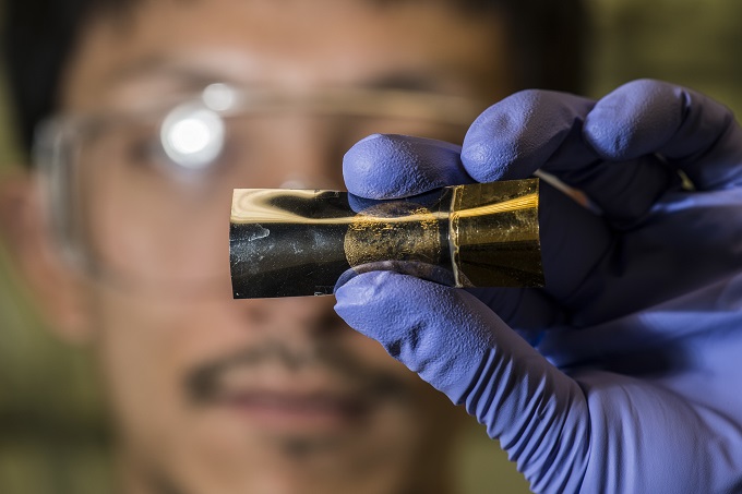 Rice University postdoctoral researcher Yang Yang holds an energy storage unit