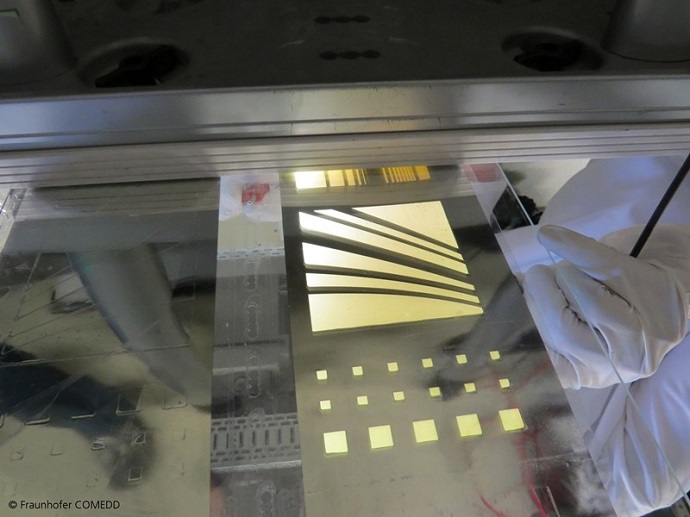 Large area bottom emitting OLED light on flexible glass