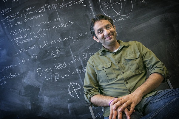 Rahul Patel beside his office blackboard