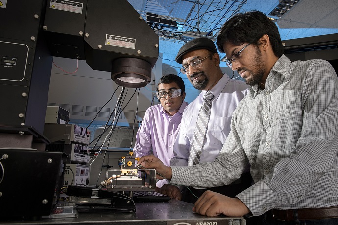 researchers operate a solar simulator