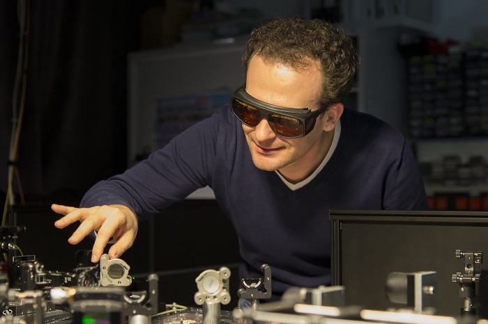 Alexander Bechtold at the laser desk in his laboratory