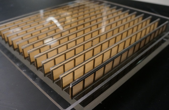 The metamaterial, shown here, is made of paper and aluminum -- but its structure allows it to manipulate acoustic waves in several ways