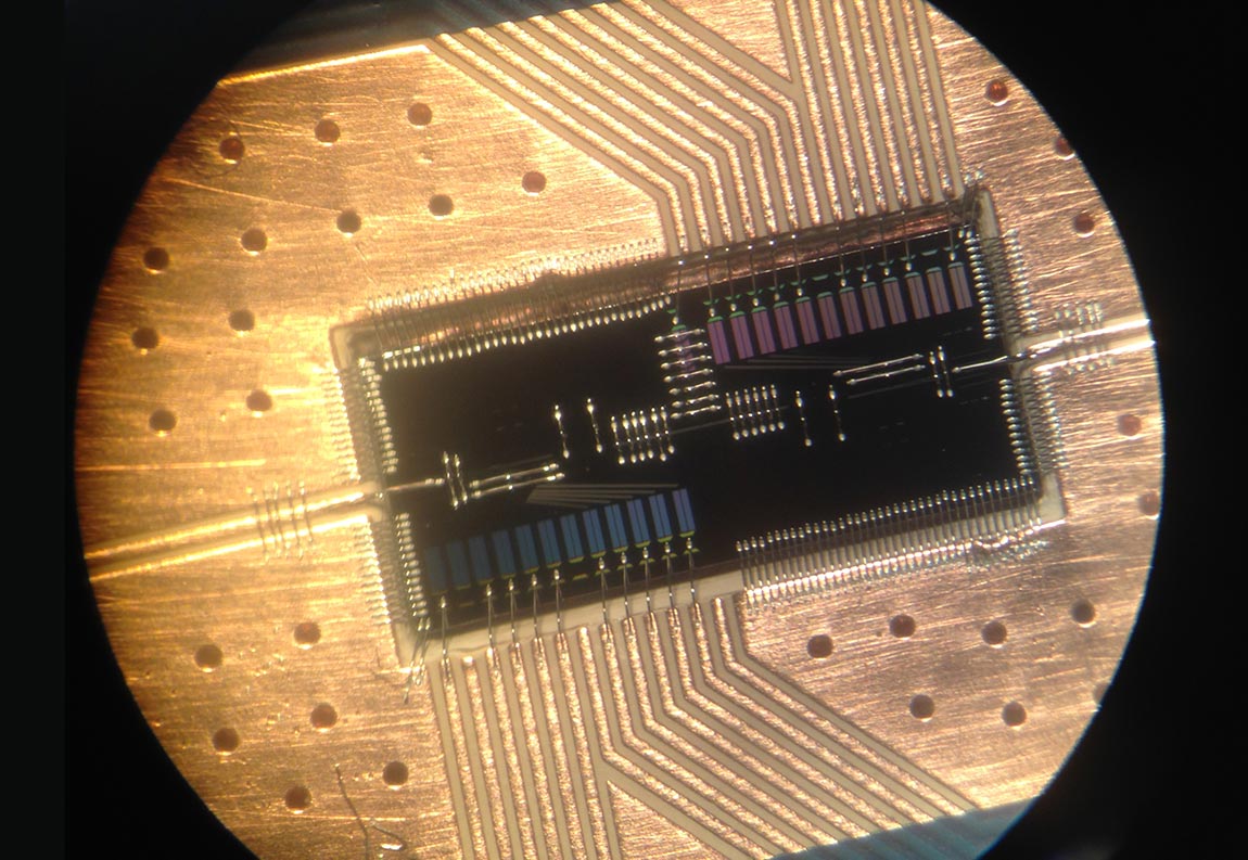 A fully packaged device for trapping and manipulating single electrons and photons