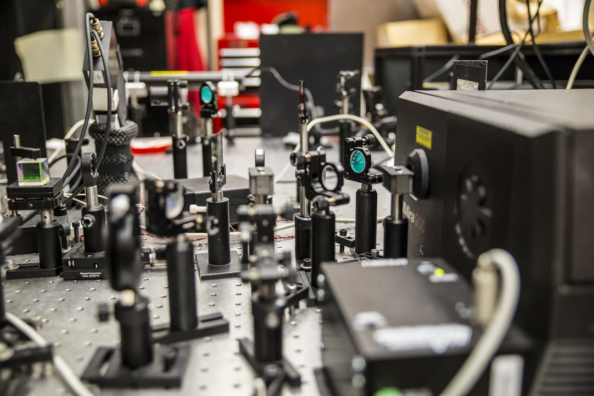 The ultrafast laser shoots very short light pulses 80 million times a second at the hybrid perovskite material to determine whether its electrons could be used to carry information in future devices