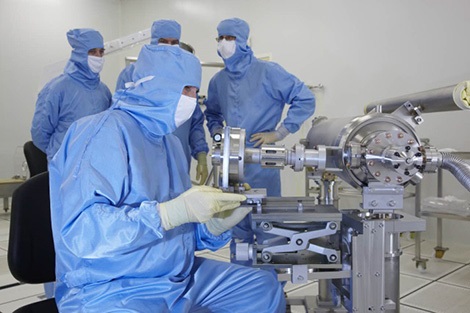 Clean-room assembly of accelerator cavities.