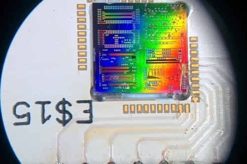 Microscope image of a silicon chip that contains tens of quantum optics experiments