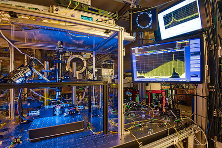 Composite photo of the test bed for NIST’s chip-based optical frequency synthesizer.