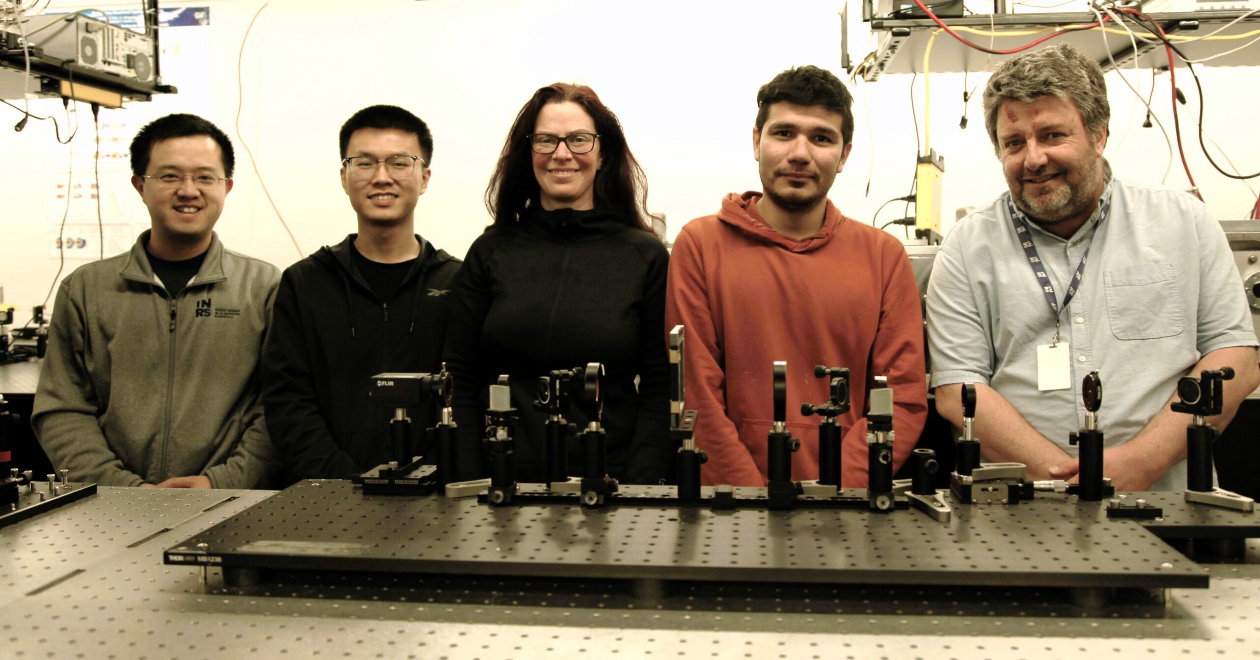 From left to right: Professor Jinyang Liang, Yingming Lai, PhD student in energy and materials science, Heide Ibrahim, Director of ALLS, Miguel Marquez, postdoctoral fellow and co-author of the study, and Professor François Légaré in front of the SCARF system at INRS.