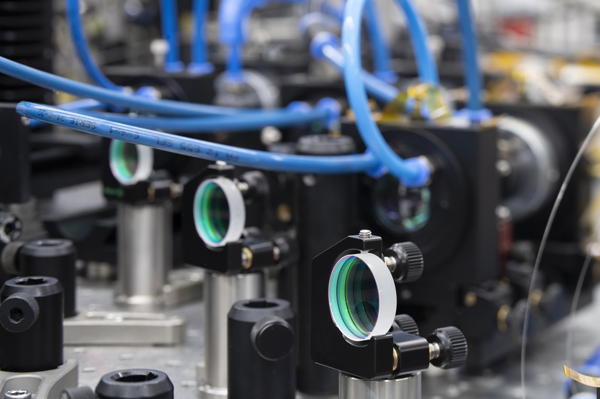 Laser output and mirror for beam guidance of three high-power laser beams.